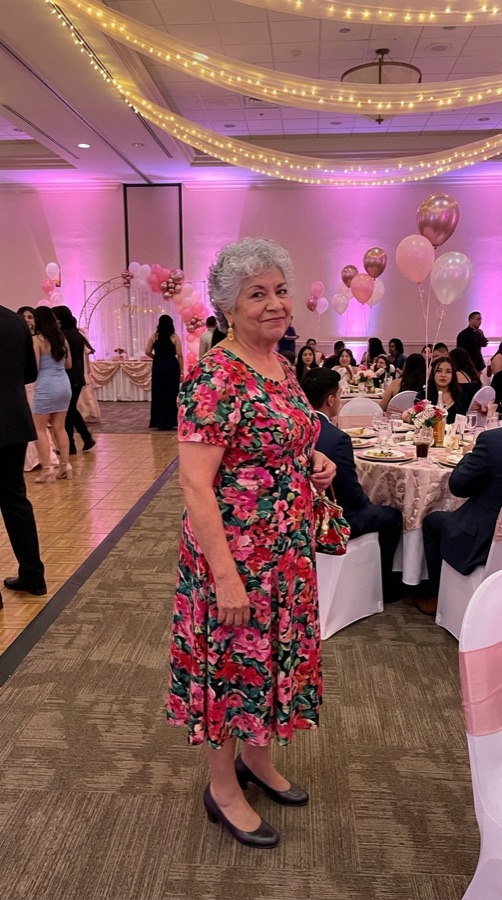 Before: a photo of a grandmother in a floral dress at a quinceañera